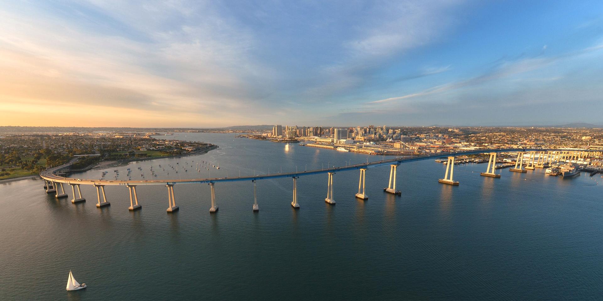 Aerial view of the Coronado Bridge and Downtown San Diego at golden hour