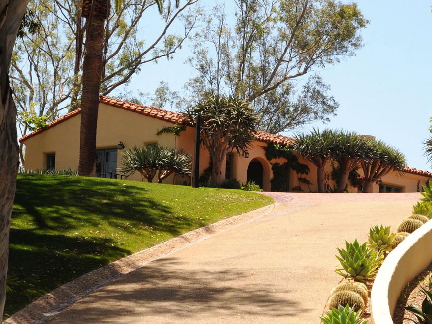 Spanish Colonial home with a curved driveway in Rancho Santa Fe
